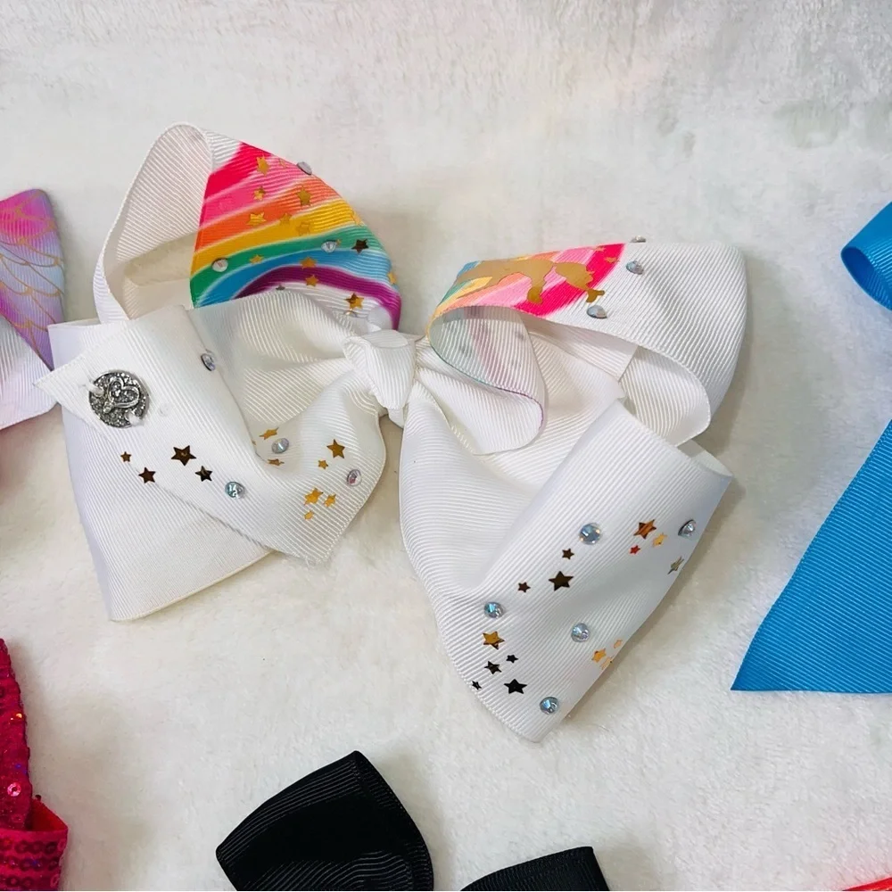 7 Cheerleader/Dance Bows Different Sizes, Colors & Holders. Missing Black Bow
